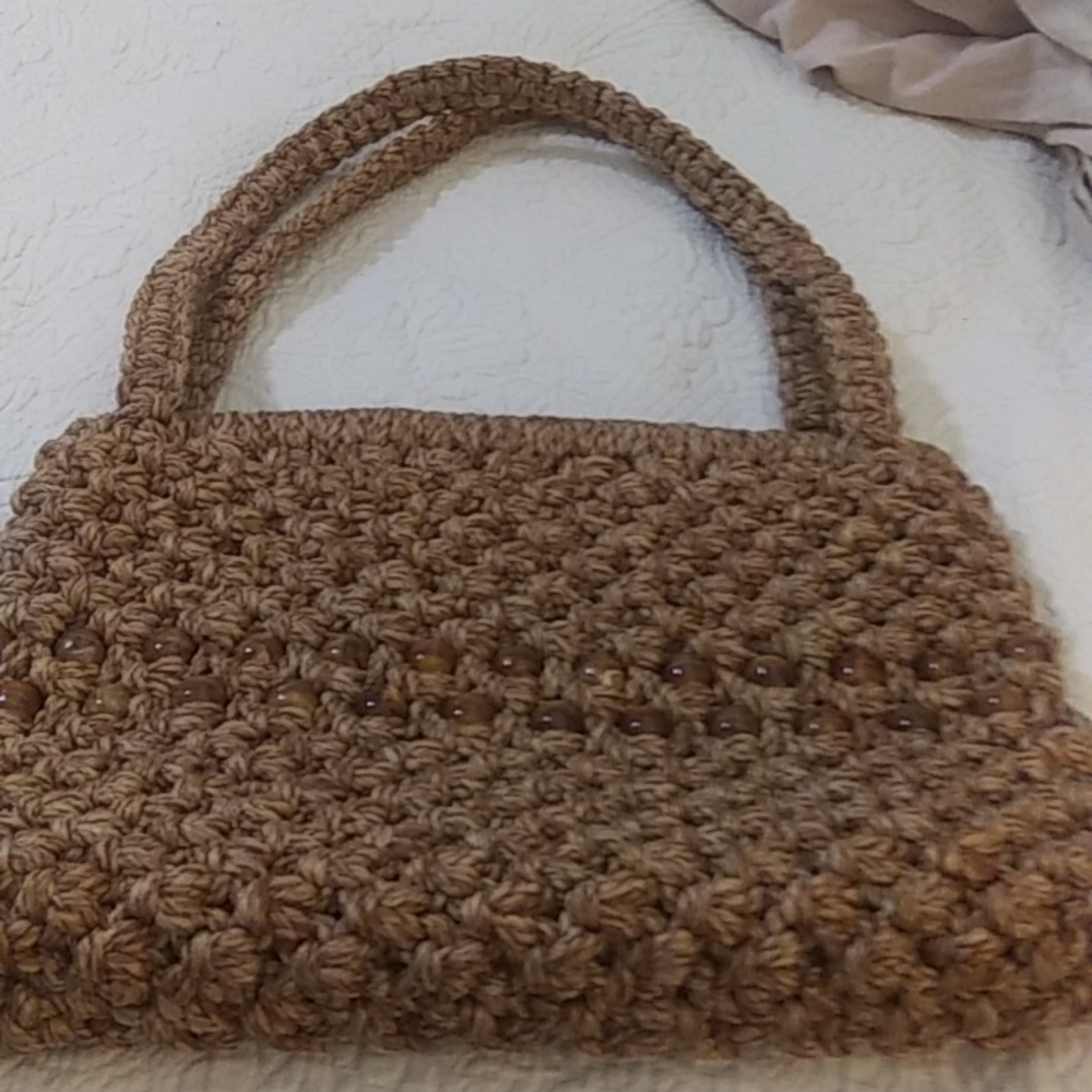 Woman macrame shoulder bag in brown tan color with 2 rows beads in middle